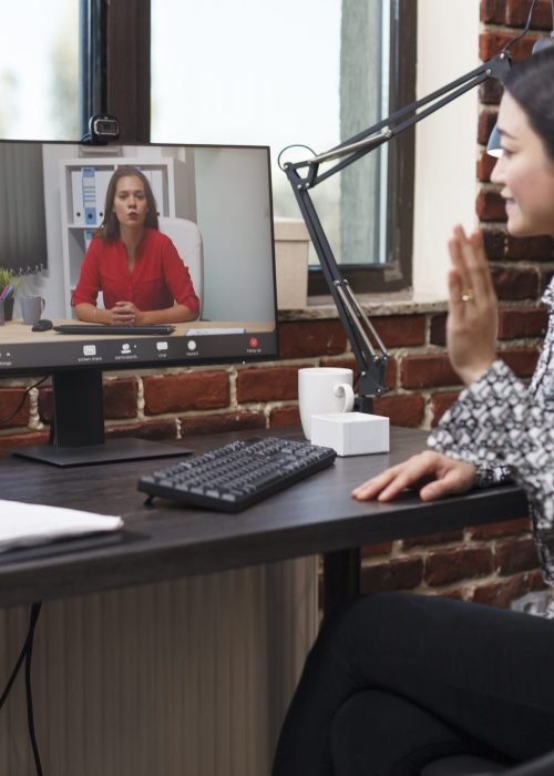 Agency asian analyst in digital videocall conference with accountant Agency asian analyst in digital videocall conference with accountant talking about revenue documentation. Businesswoman briefing team leader about failed strategy and unfinished presentation.